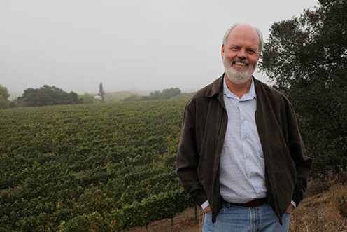 John Peterson at his vineyard on a typically foggy day